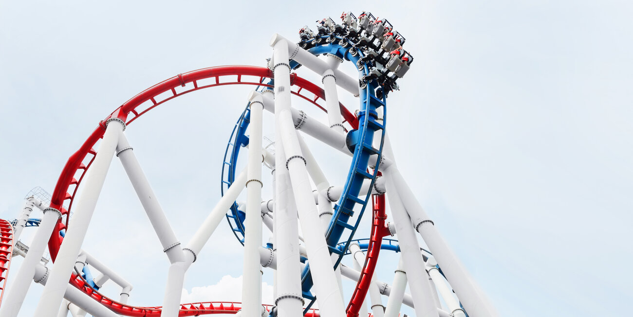 © AdobeStock_95605949_siraphol (Roller coaster rail ride in the park)